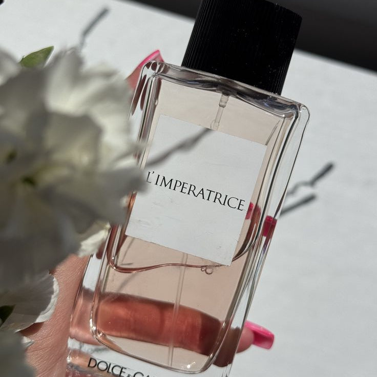Refect Beauty Dolce & Gabbana L’Impératrice Eau de Toilette bottle with pink liquid and black cap in sunlight