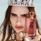 Refect Beauty model wearing a crystal crown holding a bottle of Dolce & Gabbana Q Eau de Parfum with a crown cap