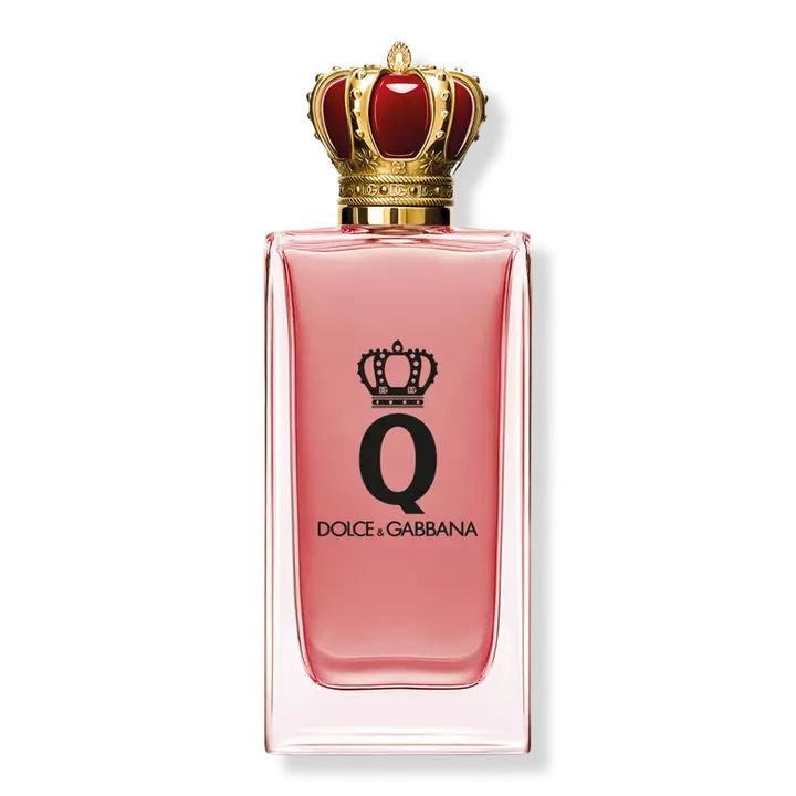 Refect Beauty Dolce & Gabbana Q Eau de Parfum in a rectangular glass bottle with a gold crown cap and pink liquid.
