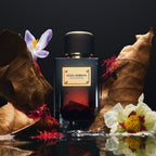 Refect Beauty Dolce & Gabbana Velvet Zafferano perfume bottle surrounded by saffron threads, dried leaves, and flowers.