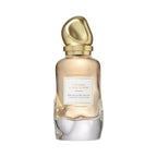 Refect Beauty Donna Karan Cashmere & Tiare Flower Eau de Parfum in a glass bottle with a gold sculptural cap.
