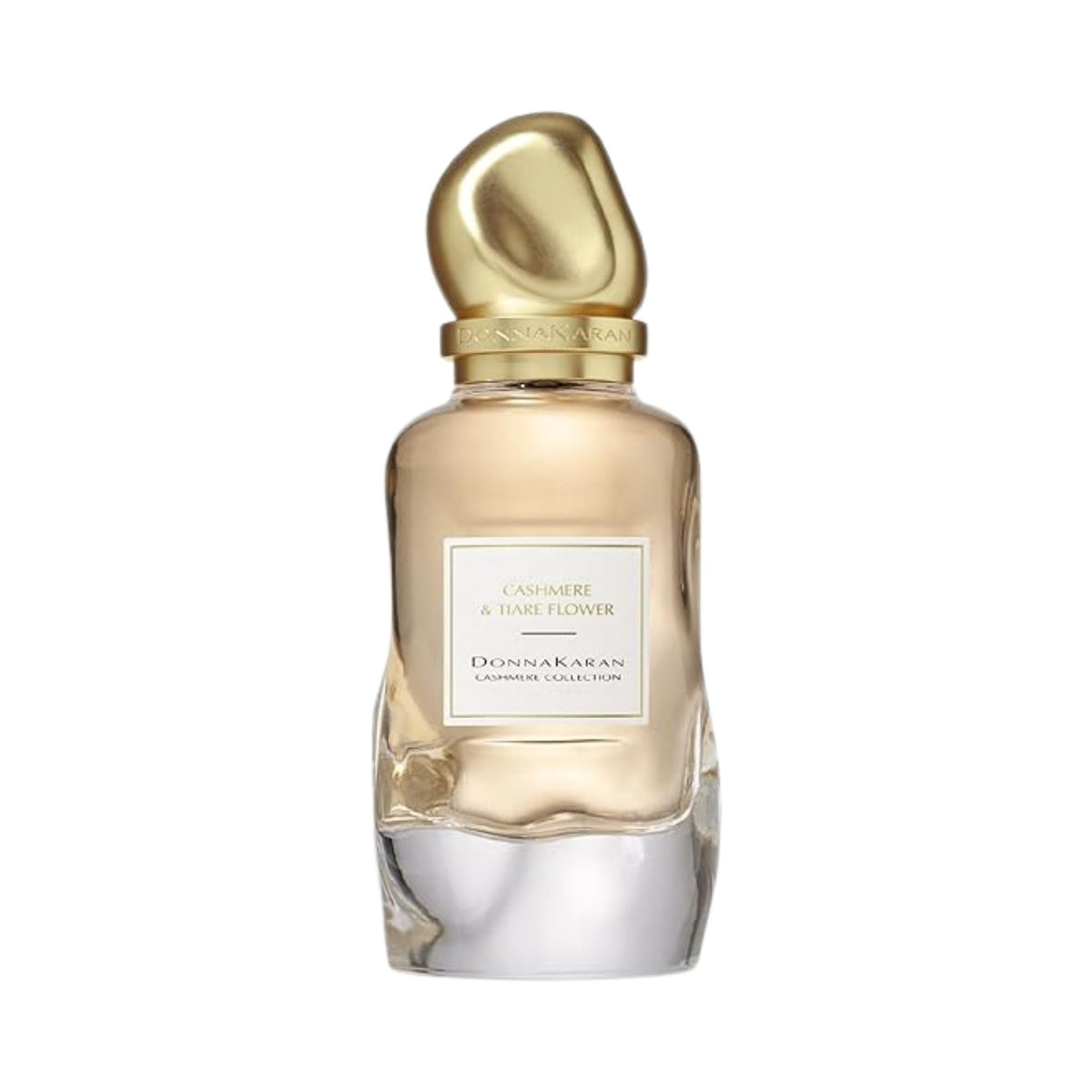 Refect Beauty Donna Karan Cashmere & Tiare Flower Eau de Parfum in a glass bottle with a gold sculptural cap.