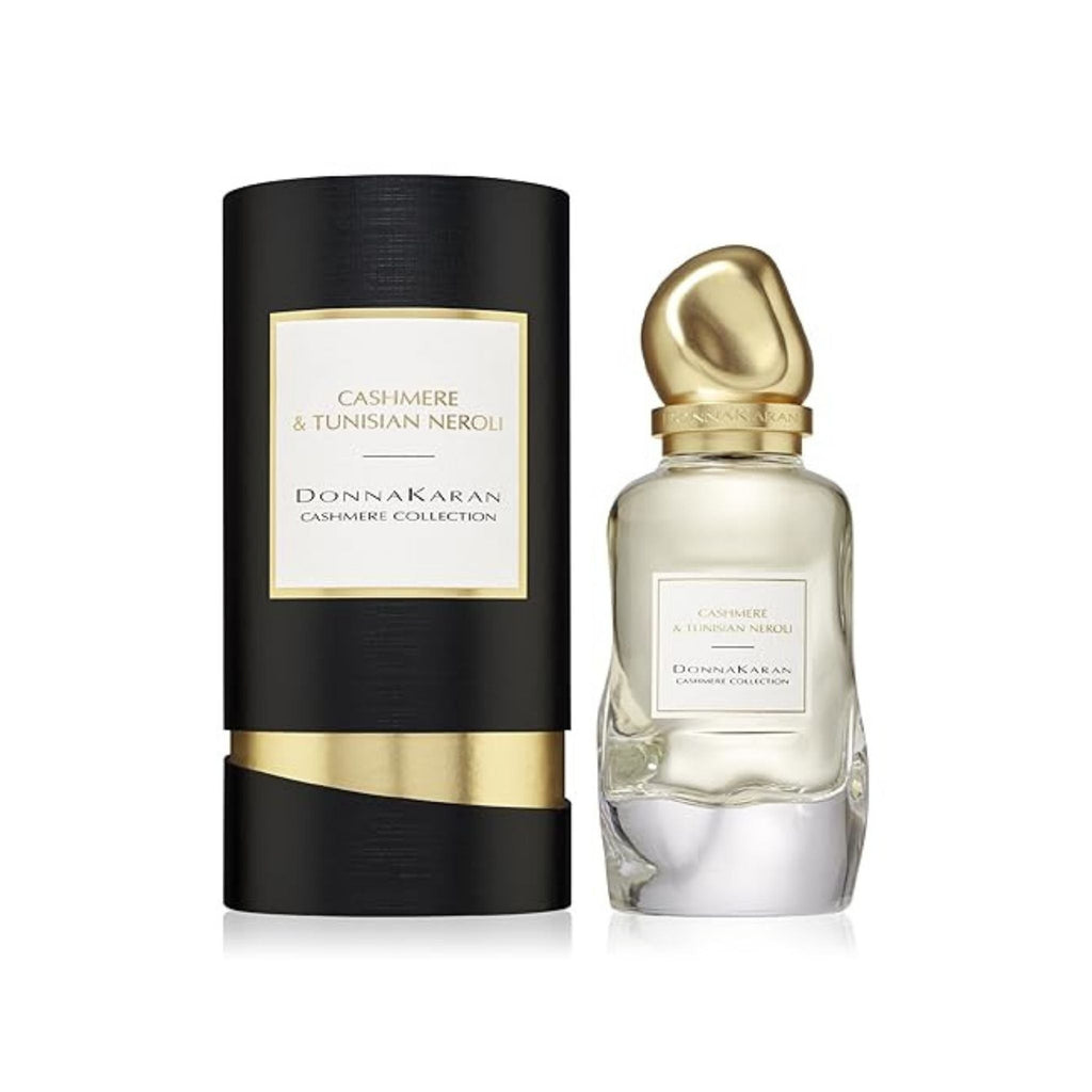 Refect Beauty Donna Karan Cashmere & Tunisian Neroli perfume bottle and black cylindrical box on white background