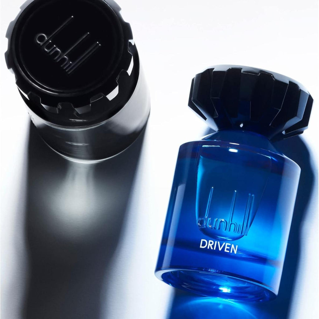 Refect Beauty Dunhill Driven Blue Eau de Toilette in a vibrant blue glass bottle with a black cap on a white surface.