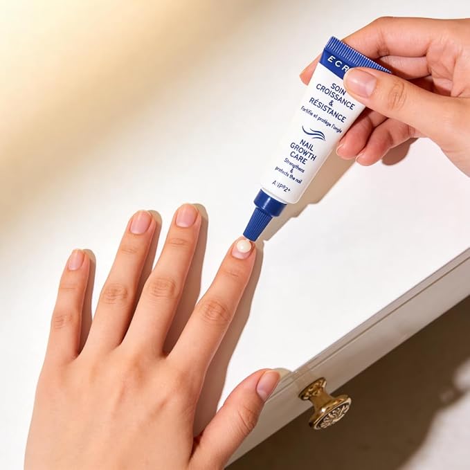Refect Beauty Ecrinal Nail Fortifying Cream being applied to a fingernail to strengthen and nourish brittle nails