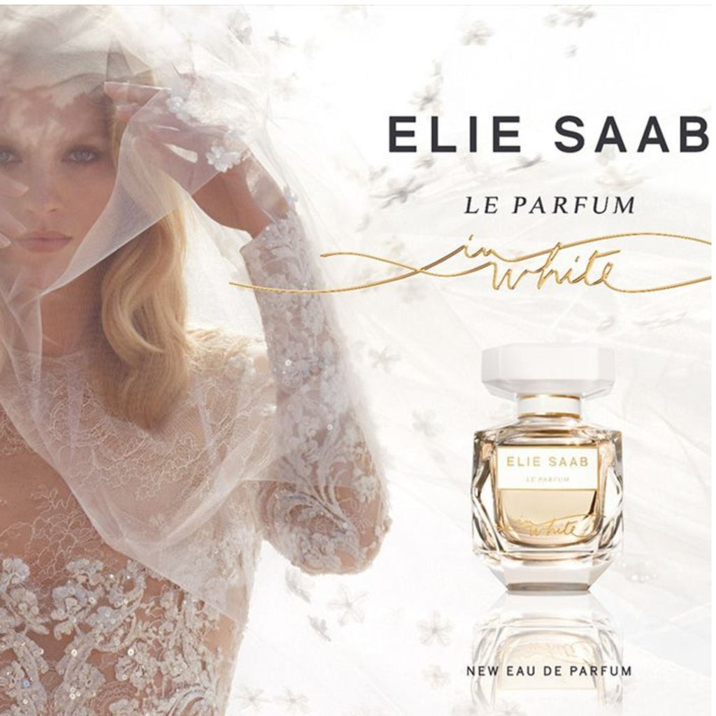Refect Beauty Elie Saab Le Parfum In White eau de parfum bottle next to a bride in a white lace veil