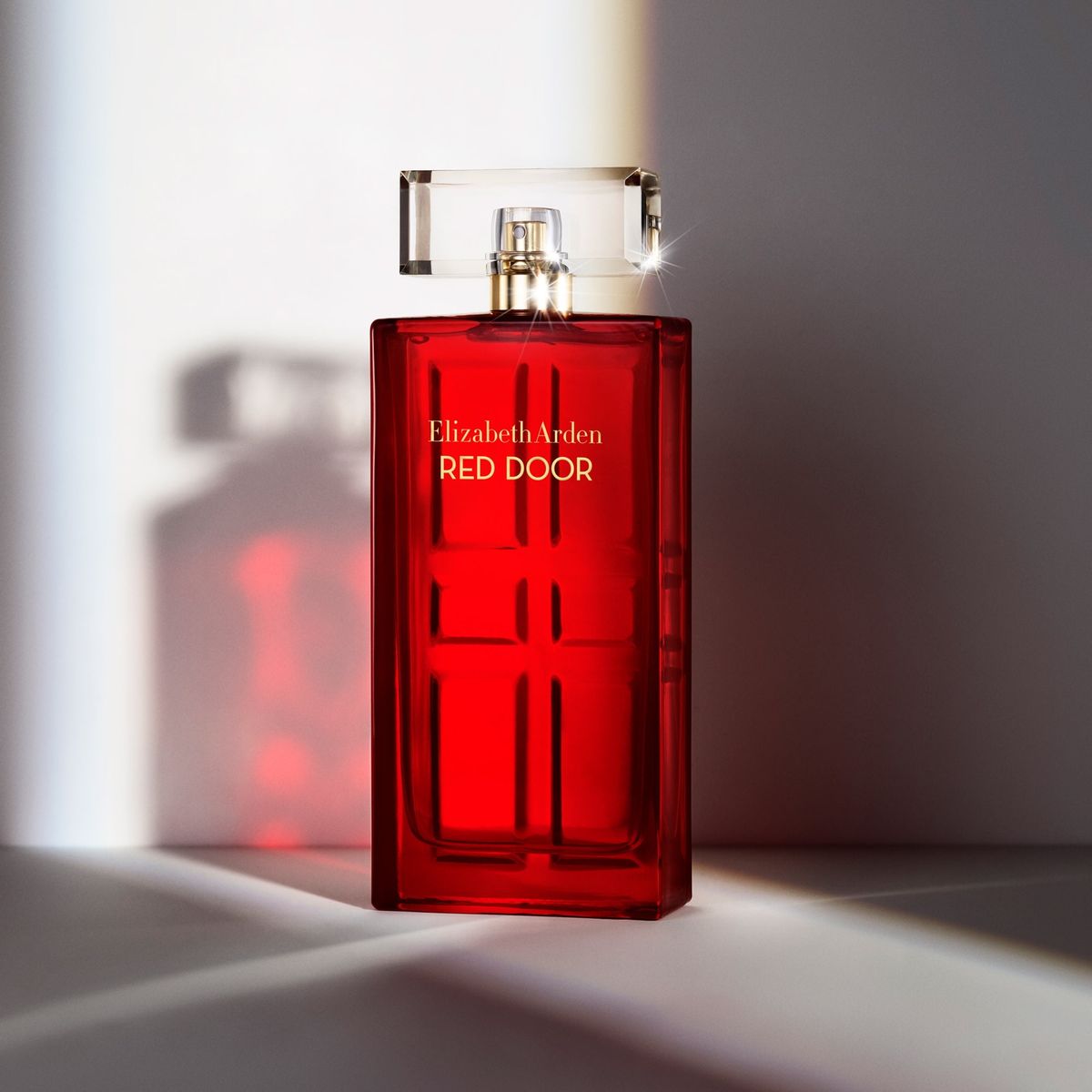 Refect Beauty Elizabeth Arden Red Door Eau de Toilette in a signature rectangular red glass bottle with gold accents.