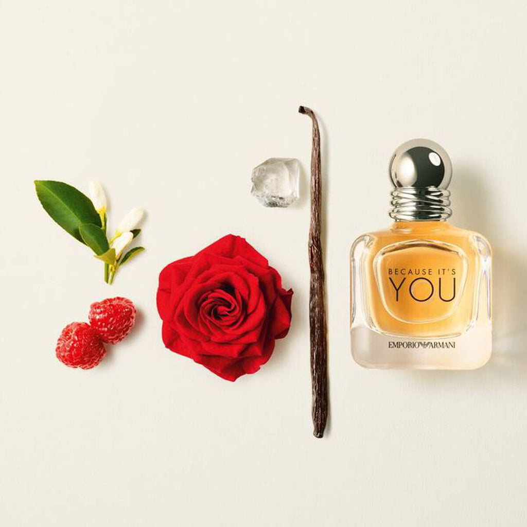 Refect Beauty Emporio Armani Because It’s You perfume bottle surrounded by raspberry, rose, and vanilla bean ingredients.