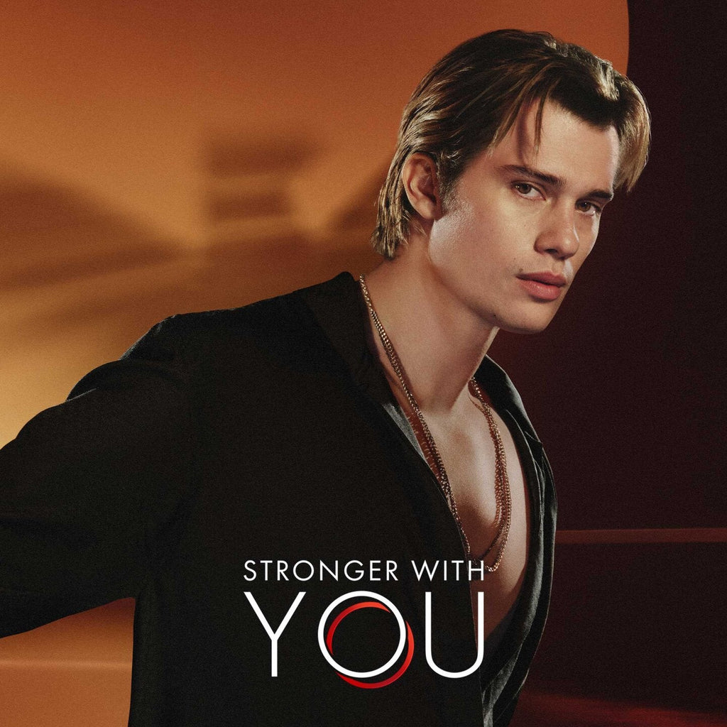 Refect Beauty campaign model for Emporio Armani Stronger With You Intensely fragrance in a dark, moody setting