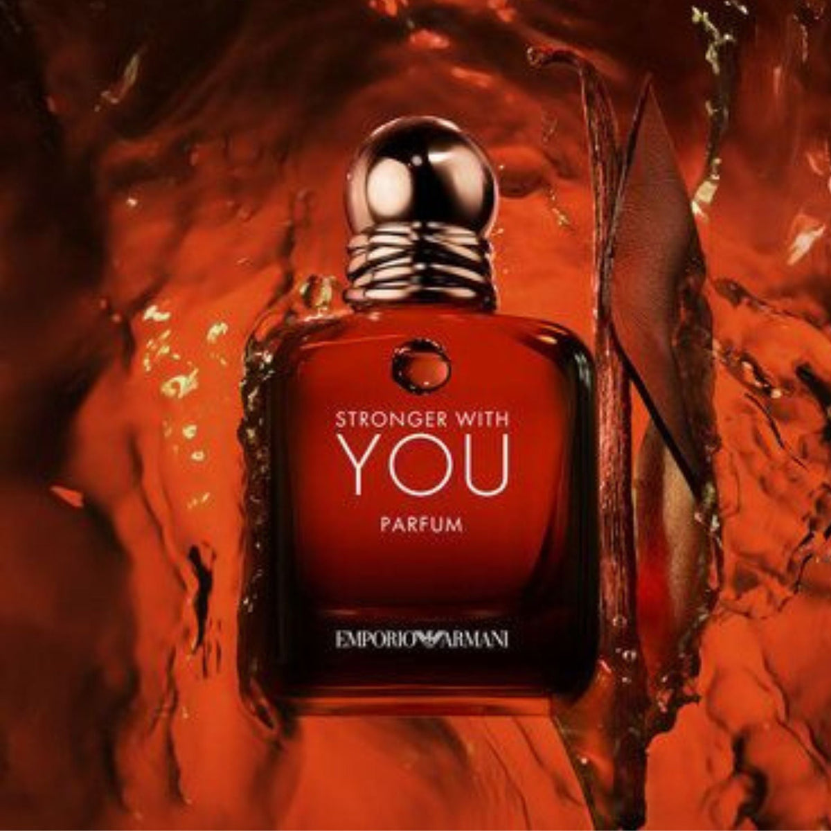 Refect Beauty Emporio Armani Stronger With You Parfum bottle in a rich amber liquid splash with vanilla bean accents.