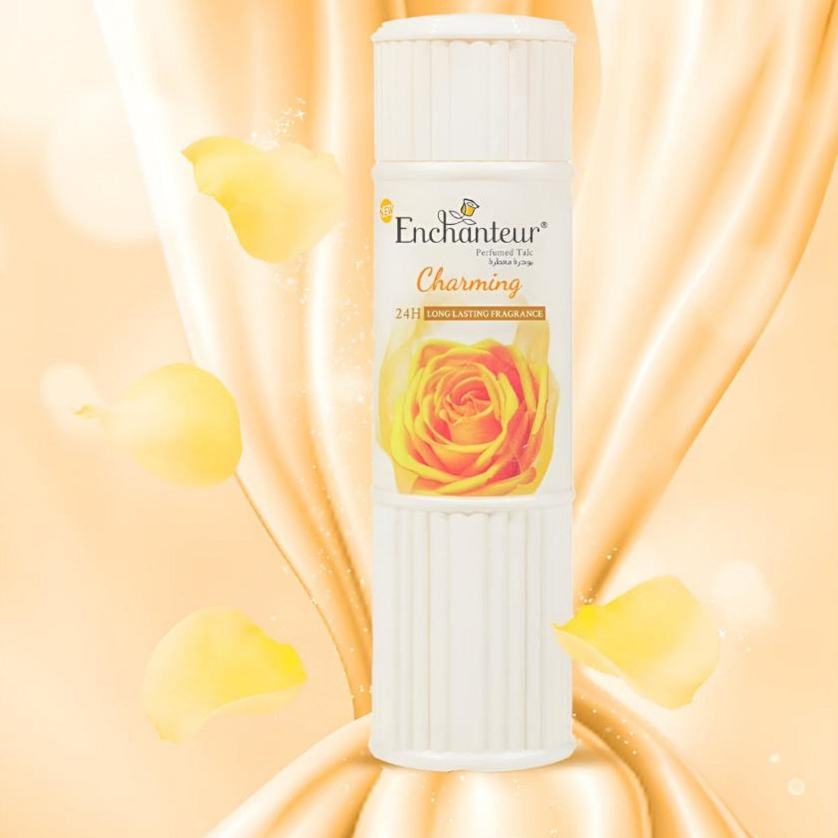 Refect Beauty Enchanteur Charming perfumed talcum powder in a white bottle with a yellow rose graphic on a silk background