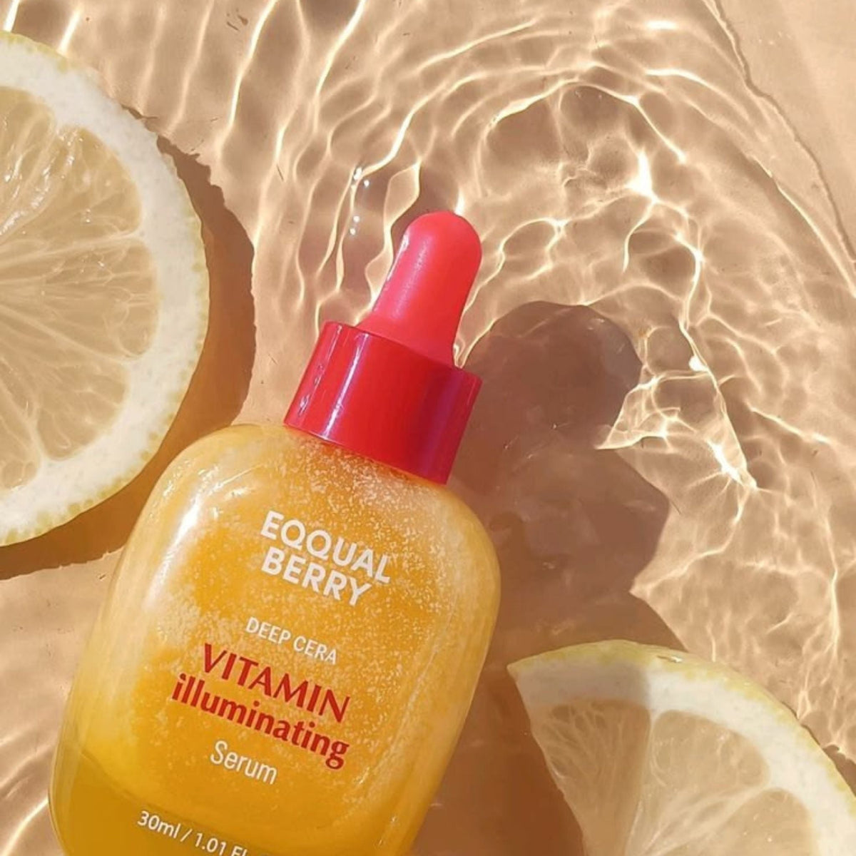Refect Beauty Eqqualberry Vitamin Illuminating Serum bottle with a red dropper cap, surrounded by fresh lemon slices.