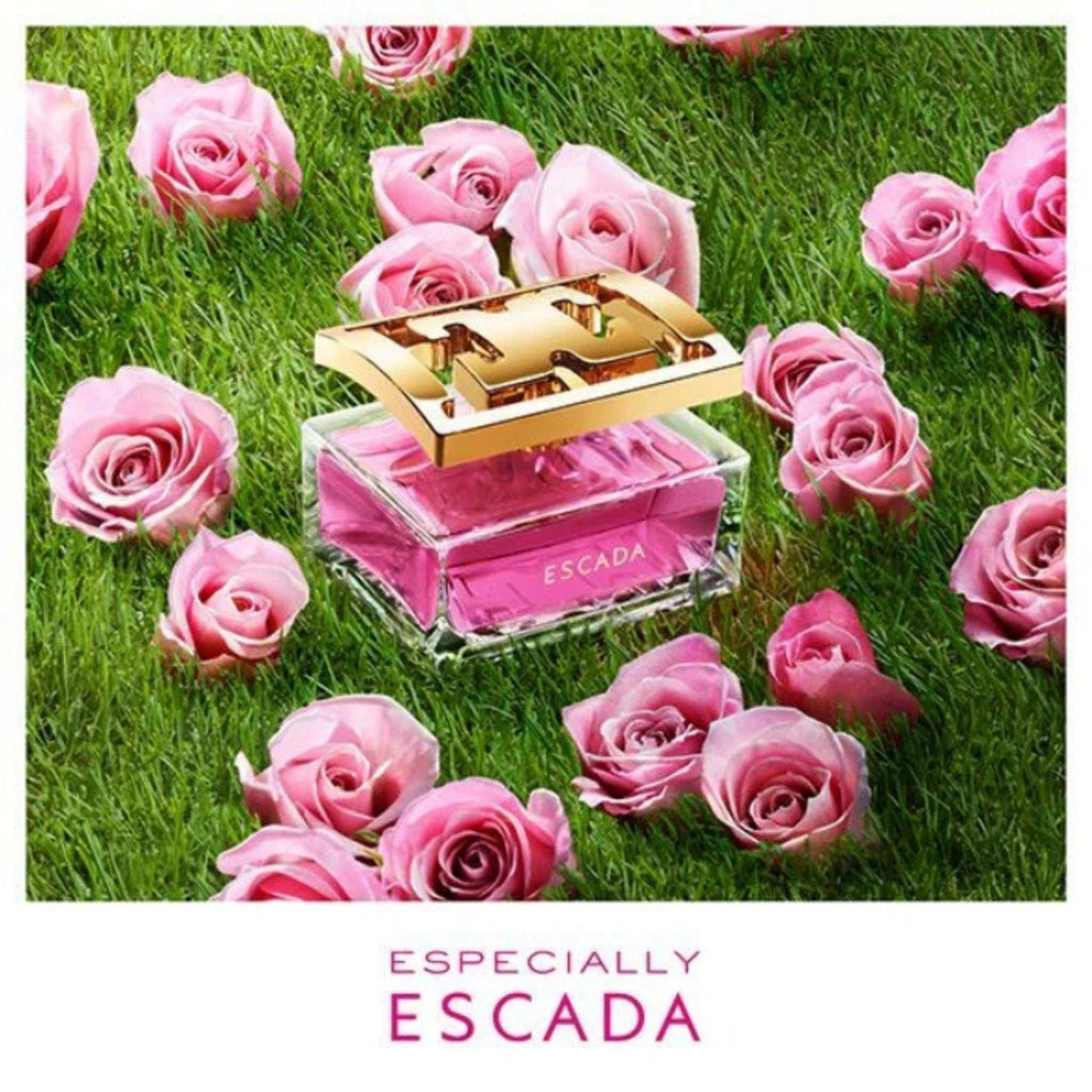 Refect Beauty Especially Escada Eau de Parfum bottle surrounded by fresh pink roses on a lush green grass field