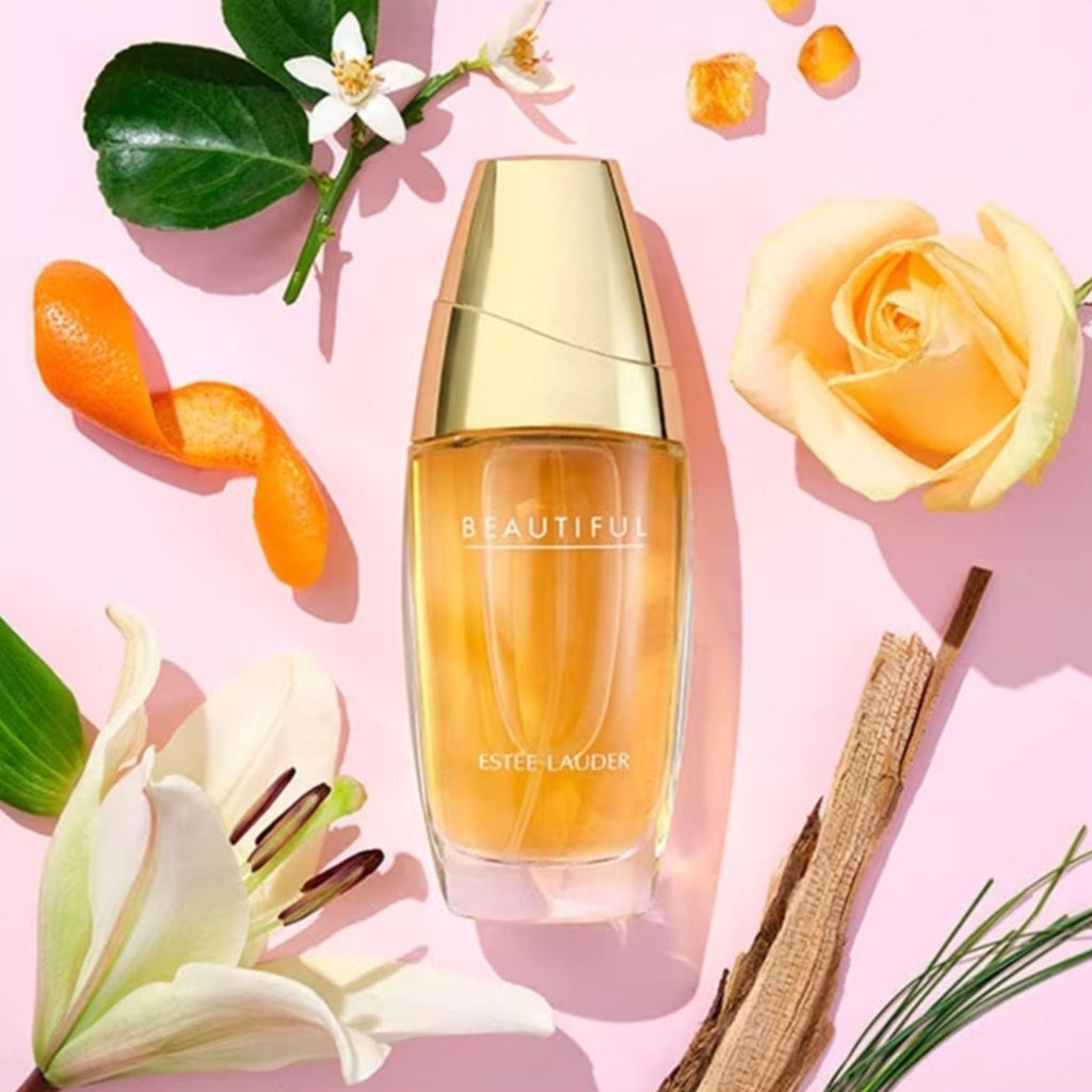 Refect Beauty Estée Lauder Beautiful Eau de Parfum bottle surrounded by rose, lily, citrus peel, and woody notes.