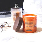 Refect Beauty Evoluderm Argan Divin nourishing hair mask in an orange jar on a wooden tray with a warm drink nearby.
