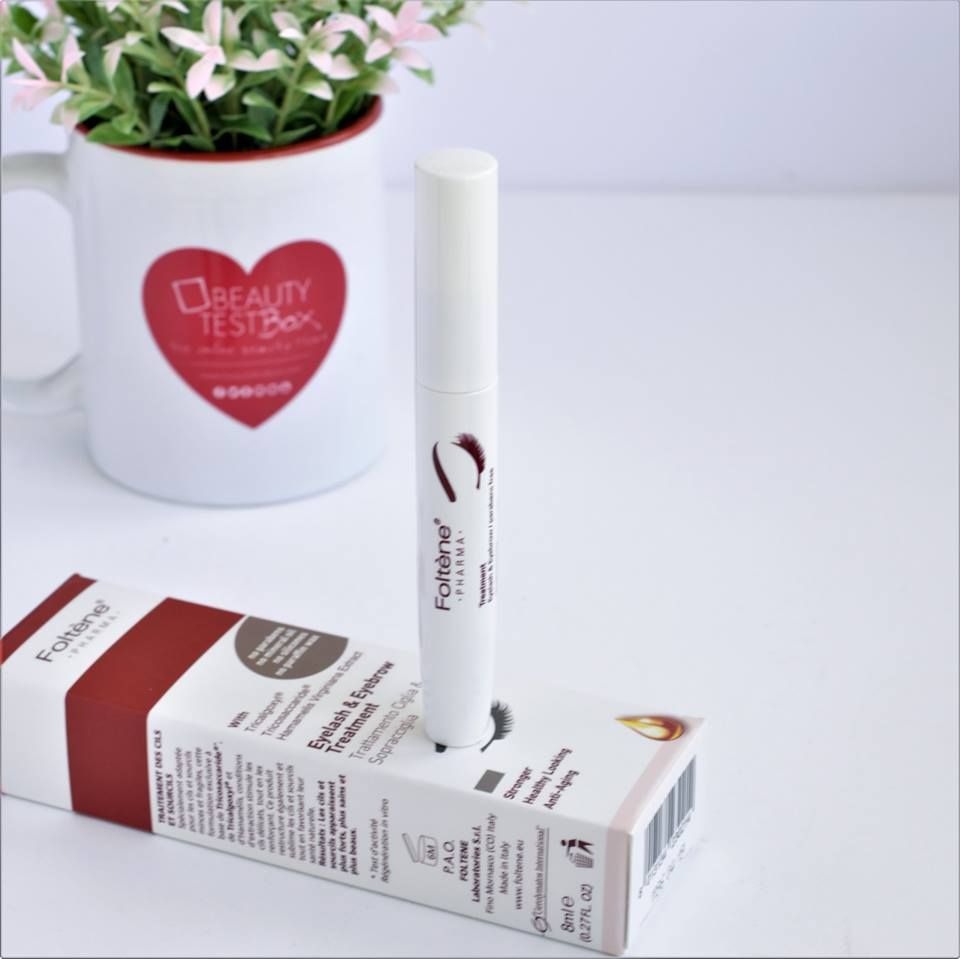 Refect Beauty Foltene Eyelash & Eyebrow Treatment tube and packaging box on a white surface with a plant background.