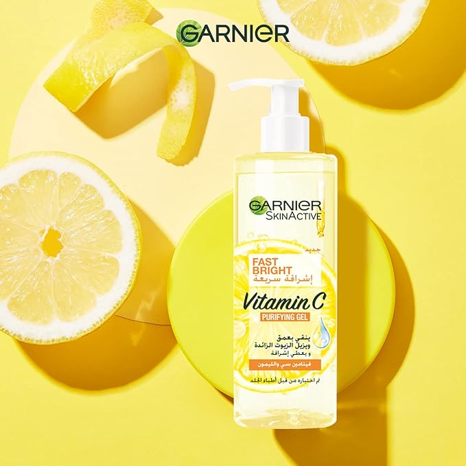 Refect Beauty Garnier Fast Bright Vitamin C Purifying Gel Wash bottle with lemon slices on a yellow background
