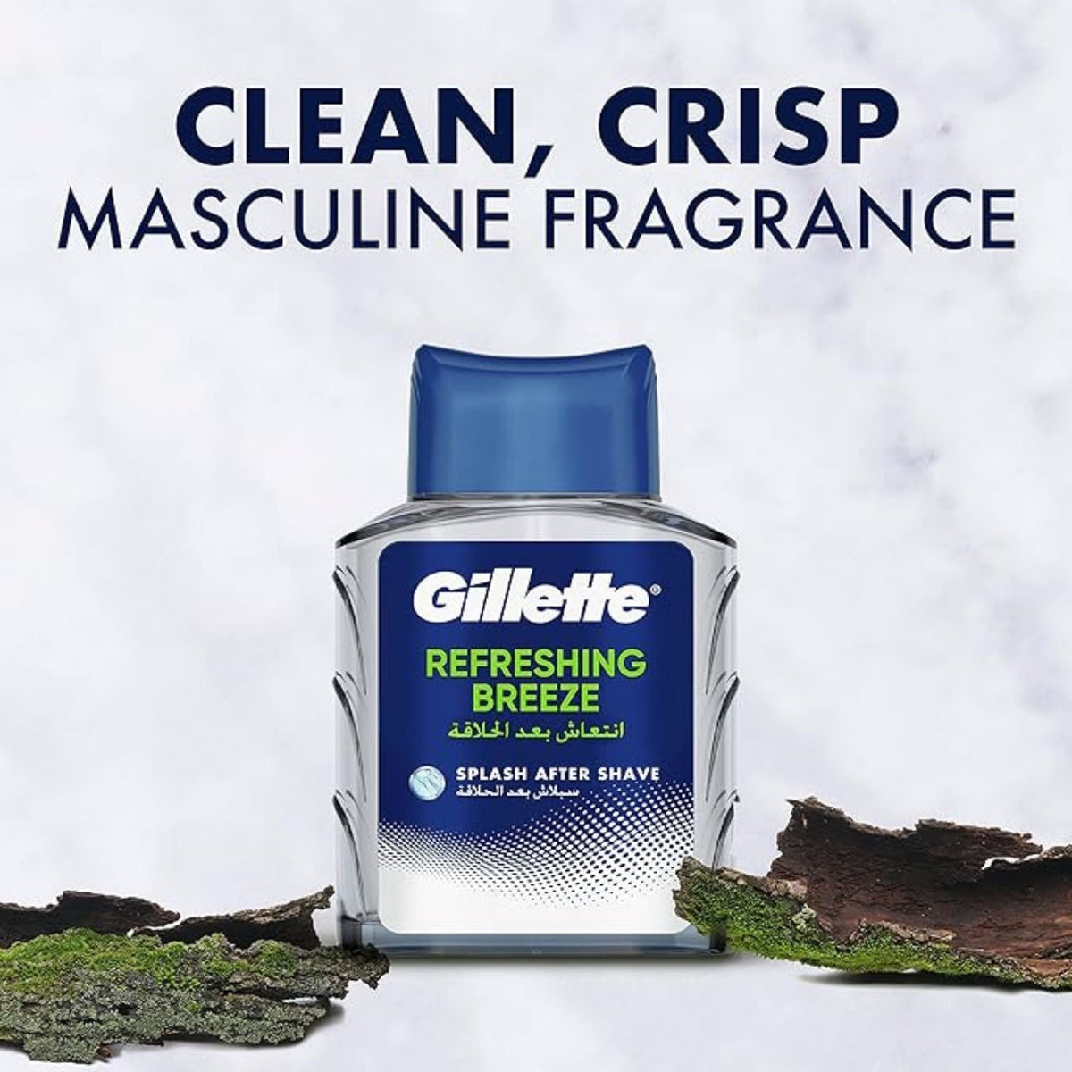 Refect Beauty Gillette Refreshing Breeze after shave splash bottle with a blue cap on a marble and bark background