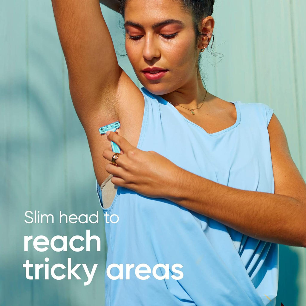 Refect Beauty Gillette Venus Simply 2 disposable razor with moisture strip being used by a woman for underarm shaving