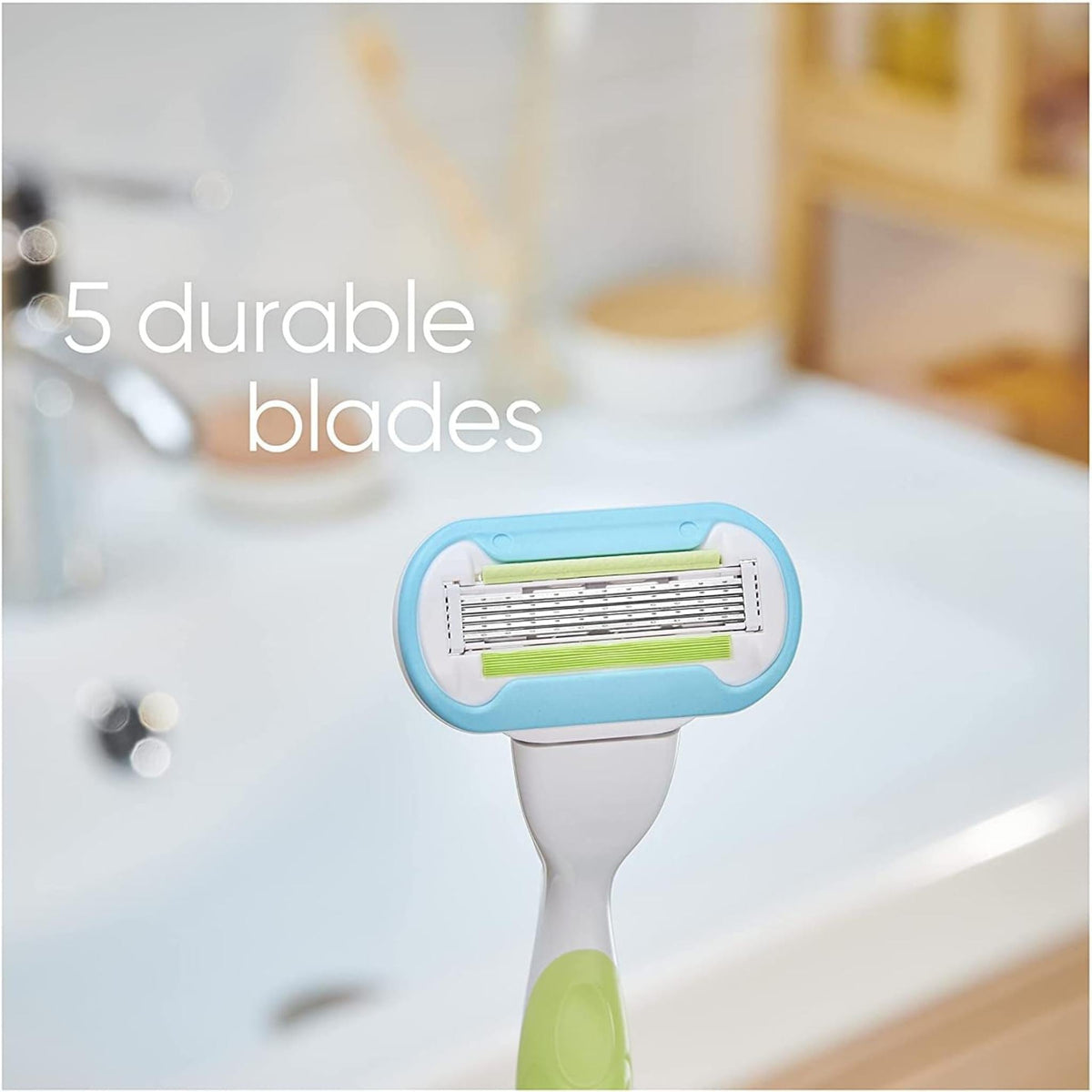 Refect Beauty Gillette Venus razor head featuring 5 blades and a light blue moisture ribbon in a bathroom setting