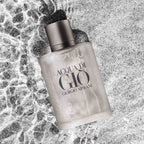 Refect Beauty Giorgio Armani Acqua Di Gio eau de toilette bottle resting on a textured grey surface with water ripples