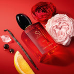 Refect Beauty Giorgio Armani Si Passione Eclat perfume bottle surrounded by roses, black currants, and bergamot