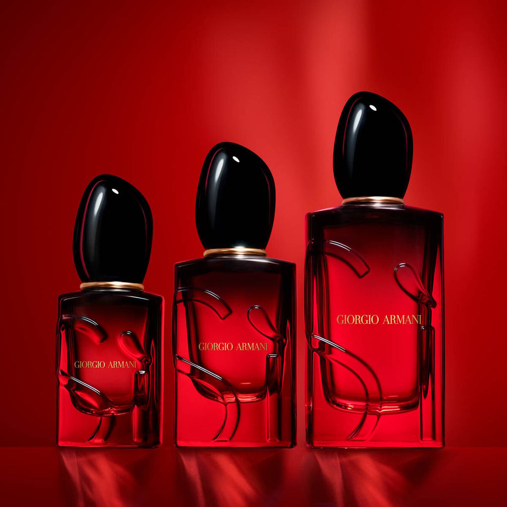 Refect Beauty Giorgio Armani Si Passione Eau de Parfum Intense bottles in three sizes against a vibrant red background