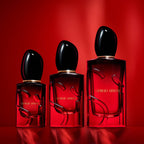 Refect Beauty Giorgio Armani Si Passione Eau de Parfum Intense bottles in three sizes against a vibrant red background