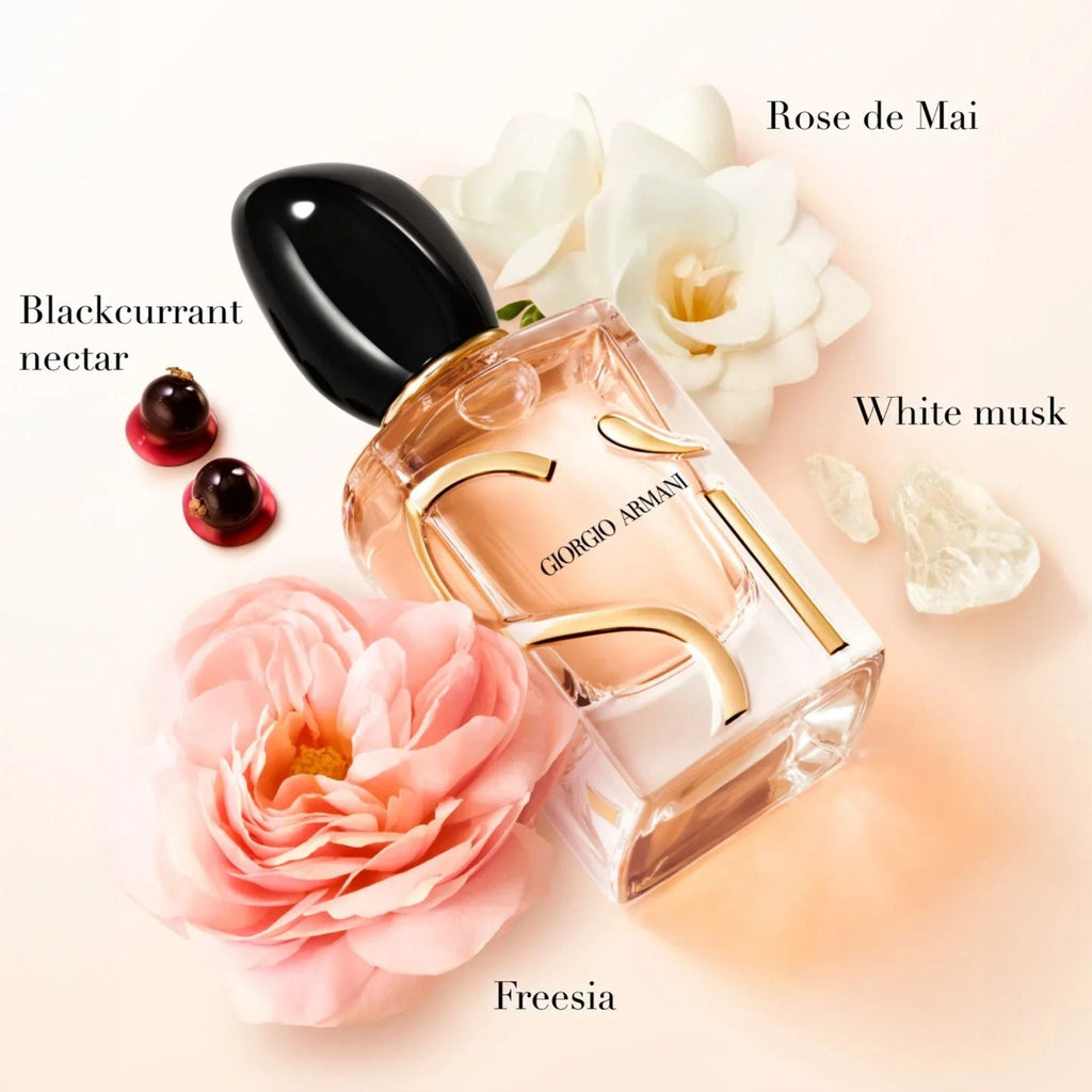 Refect Beauty Giorgio Armani Si Eau de Parfum bottle surrounded by blackcurrant, rose, and freesia floral accents.