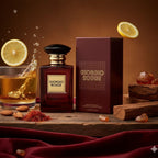 Refect Beauty Giorgio Rouge unisex eau de parfum bottle and box with lemon, wood, and spice on a rustic wooden table.