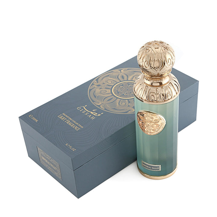 Refect Beauty GISSAH Imperial Valley unisex fragrance bottle with ornate gold cap next to its elegant blue gift box