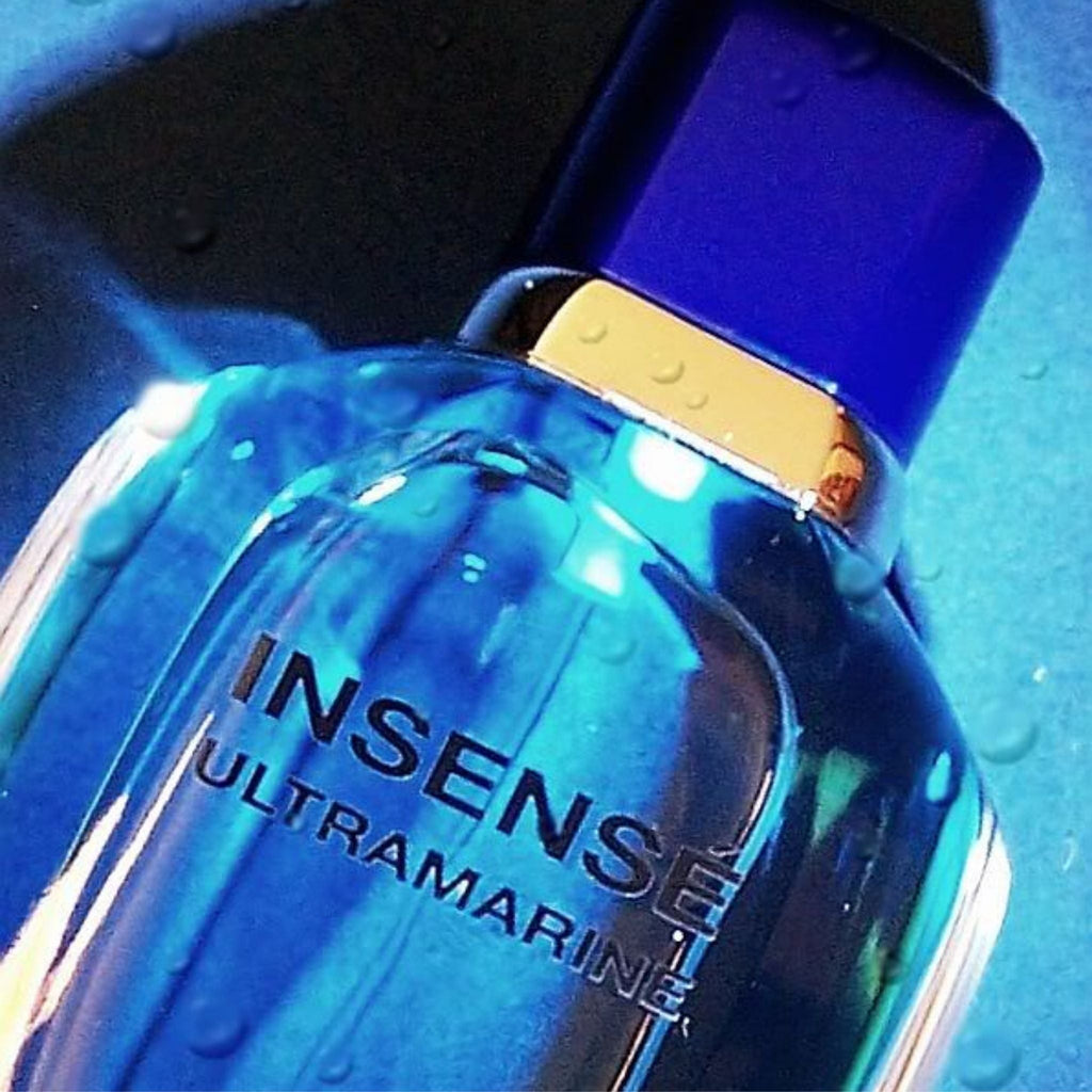 Refect Beauty Givenchy Insense Ultramarine eau de toilette bottle with blue glass and cap on a wet aquatic background