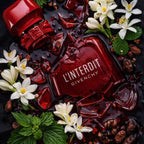 Refect Beauty Givenchy L'Interdit Rouge perfume bottle surrounded by white jasmine flowers and red glass shards.