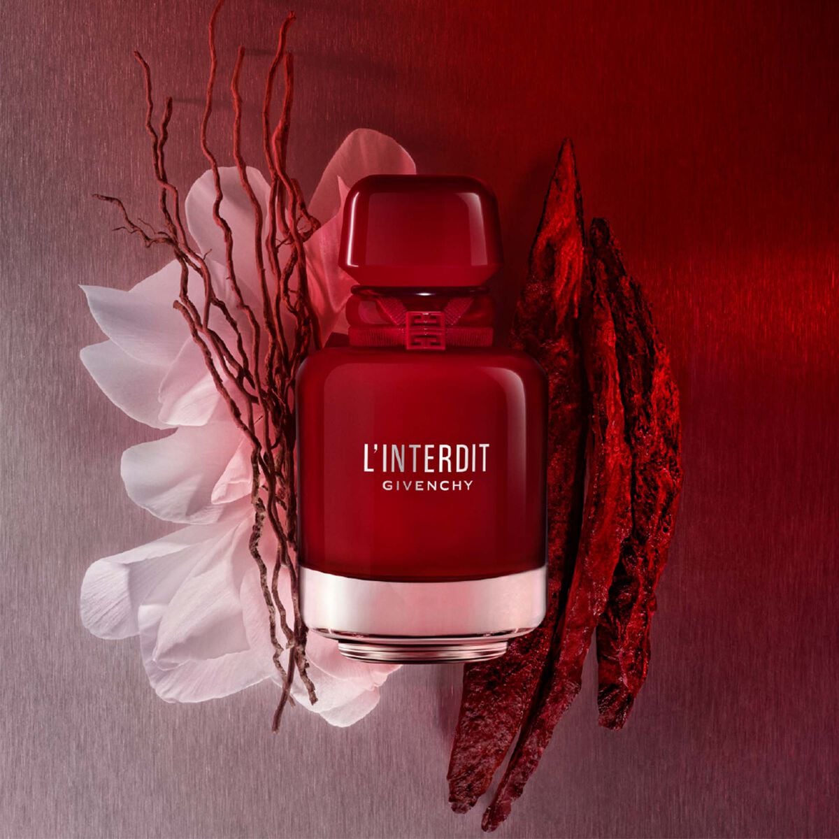 Refect Beauty Givenchy L'Interdit Rouge Ultime perfume bottle in deep red glass with floral and woody accents