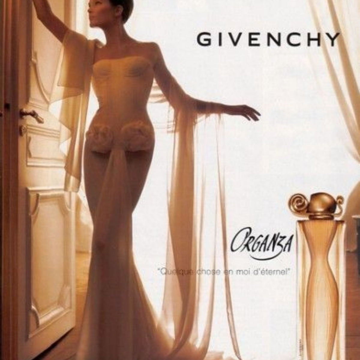 Refect Beauty Givenchy Organza perfume bottle next to a woman in a flowing beige gown in a sunlit room
