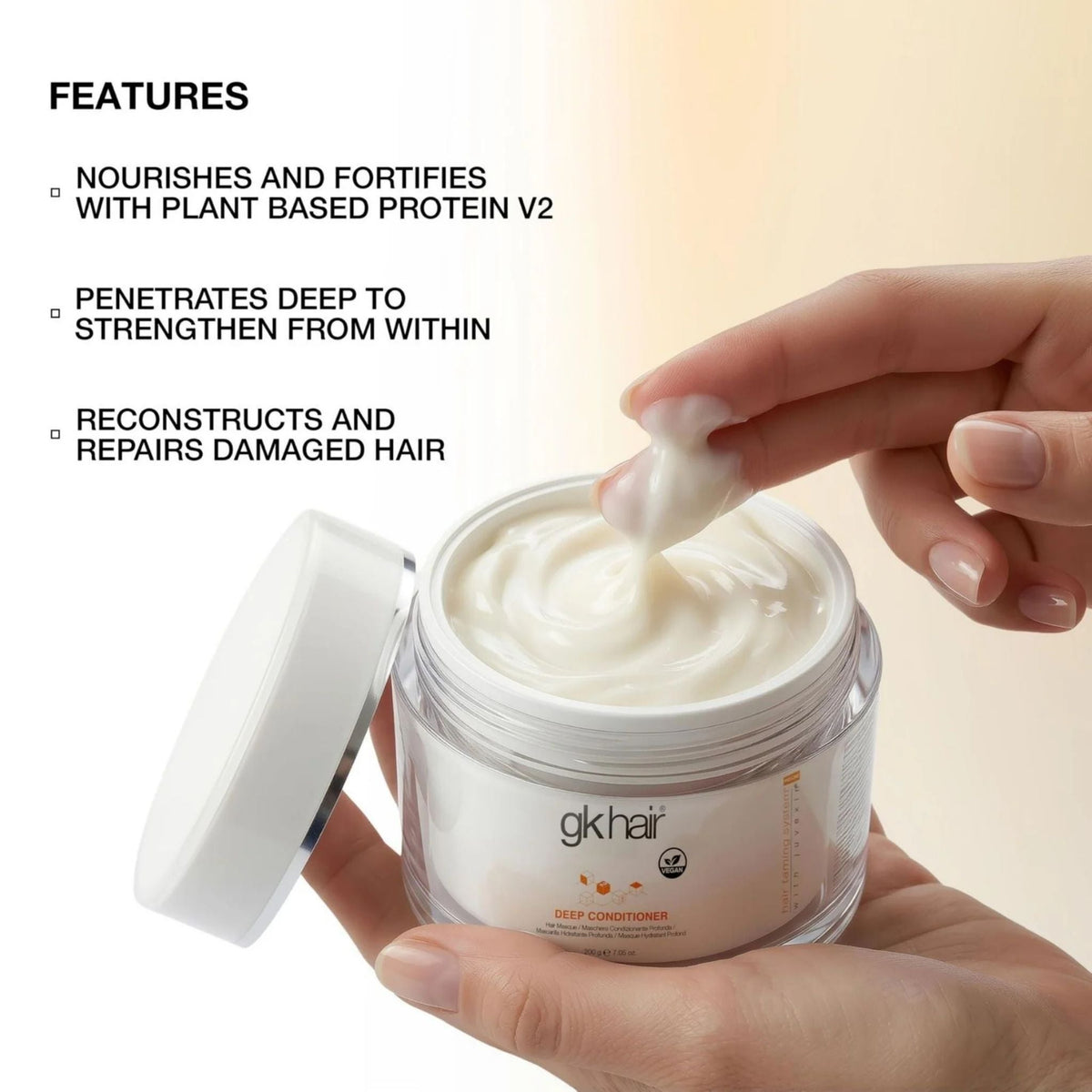 Refect Beauty GK Hair deep conditioner mask in a jar with creamy texture being scooped by fingers for hair repair