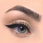 Refect Beauty Golden Rose glossy black liquid eyeliner applied in a sharp winged style on a model's eyelid