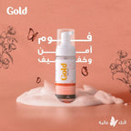 Refect Beauty Gold Cleansing Feminine Foam bottle with pump dispenser on a soft peach background with floral accents