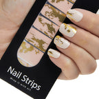 Refect Beauty Yolo nail strips featuring a cream base with metallic gold foil accents applied to fingernails