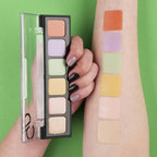 Refect Beauty Golden Rose concealer palette with six colorful cream shades swatched on a model arm against green