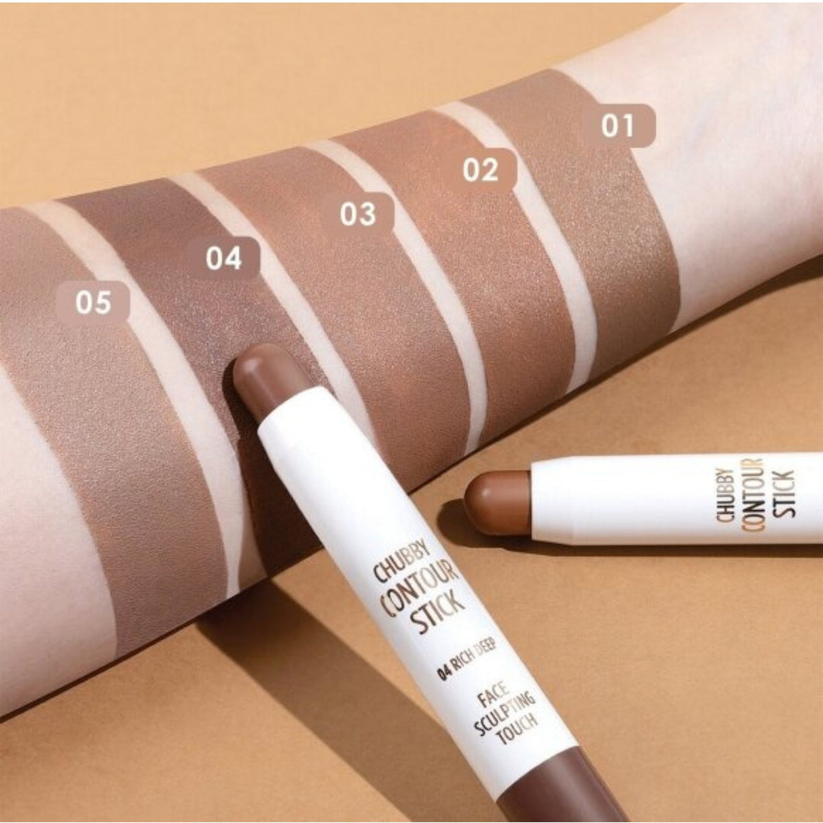 Refect Beauty Golden Rose Chubby Contour Stick swatches on arm showing various matte brown shades for face sculpting