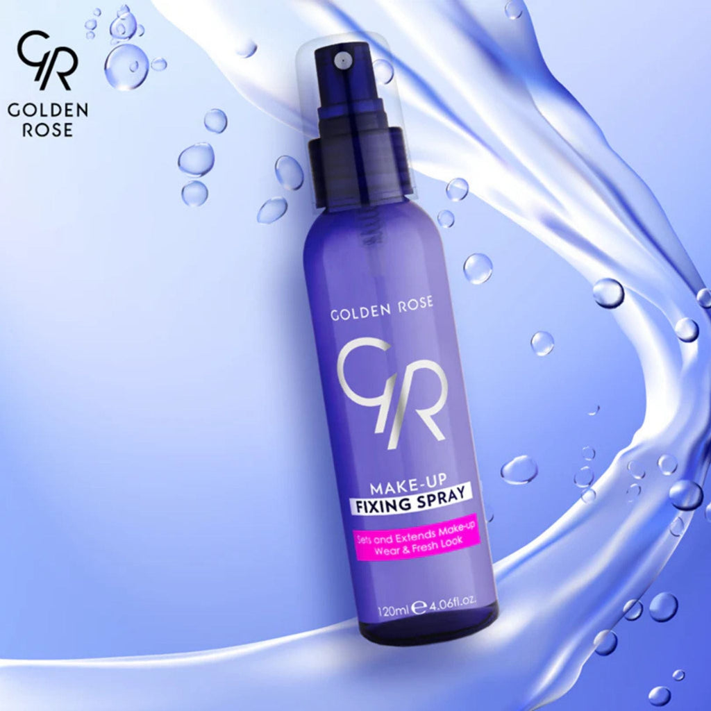 Refect Beauty Golden Rose makeup fixing spray in a purple bottle with a spray nozzle against a water splash background