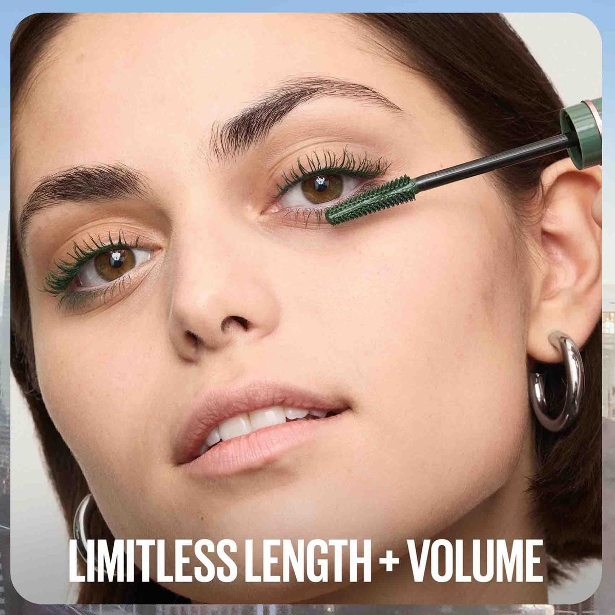 Refect Beauty model applying green Maybelline Sky High mascara to lashes for extreme length and volume