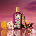 Refect Beauty Gucci Flora Gorgeous Gardenia Intense perfume bottle with gardenia flower, orange slice, and driftwood.