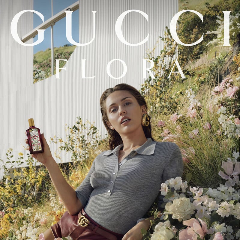 Refect Beauty campaign featuring Miley Cyrus holding a bottle of Gucci Flora Gorgeous Gardenia Intense perfume
