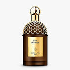 Refect Beauty Guerlain Absolus Allegoria Cuir Intense perfume bottle with gold honeycomb cap and dark glass base.