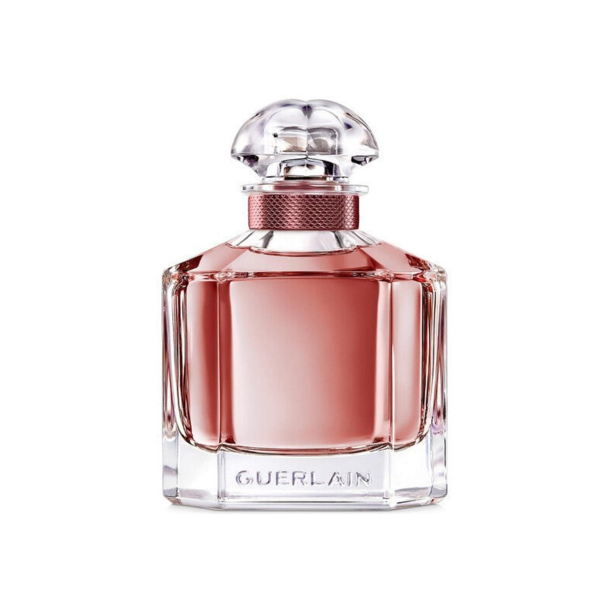 Refect Beauty Guerlain Mon Guerlain Eau de Parfum in a clear glass bottle with a rose-tinted liquid and ornate cap.