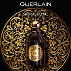 Refect Beauty Guerlain Santal Royal Eau de Parfum in a black bottle with gold label against an ornate gold background.