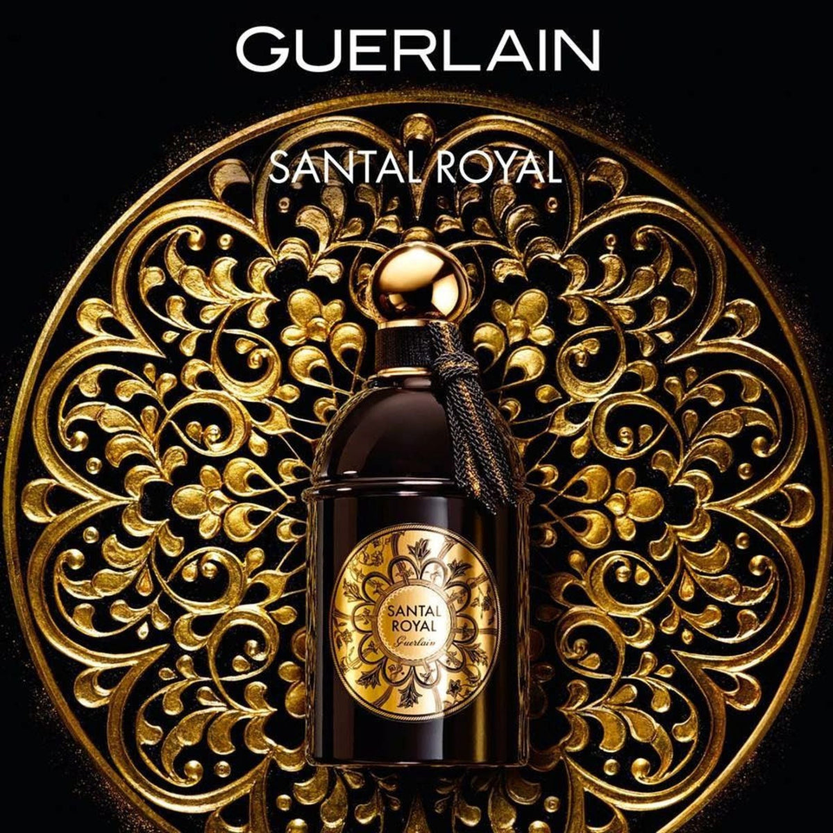 Refect Beauty Guerlain Santal Royal Eau de Parfum in a black bottle with gold label against an ornate gold background.