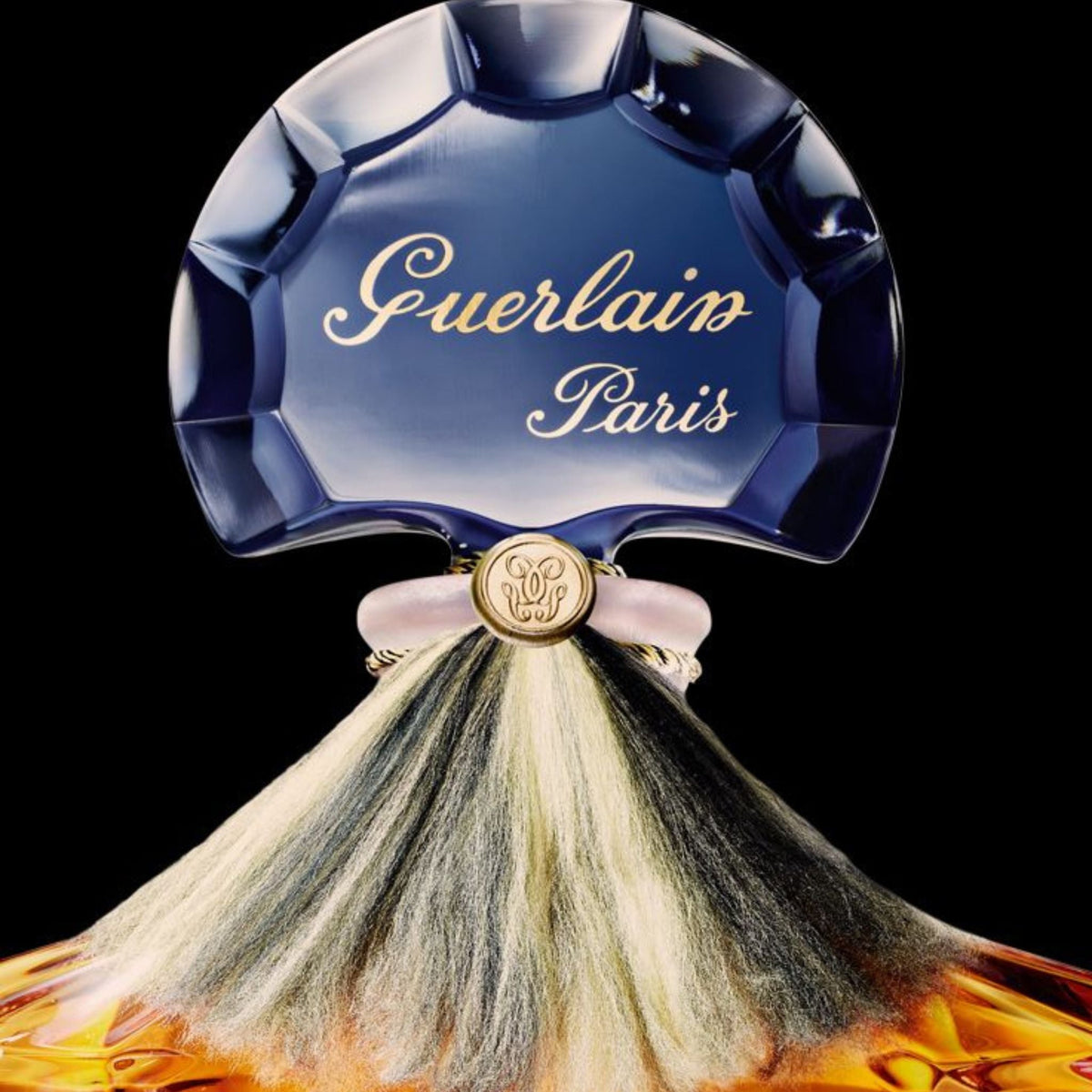 Refect Beauty Guerlain Shalimar Eau de Parfum bottle featuring a signature blue fan-shaped stopper and silk tassel